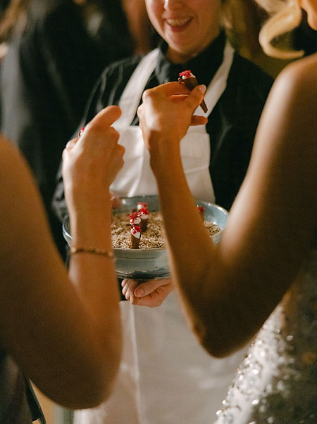 waitress serving guests small ice-creams