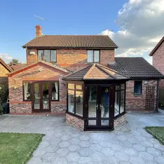 small conservatory on stone patio
