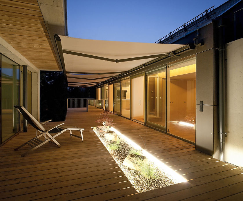 One family house, wooden terrace with awnings in the evening