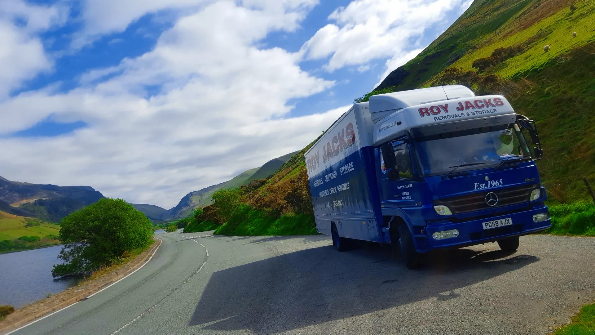 Roy Jacks van near lakeside setting