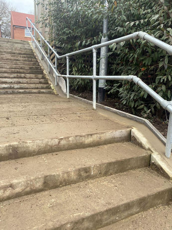 Close-up of stairs and railing as part of an adoptions project before image