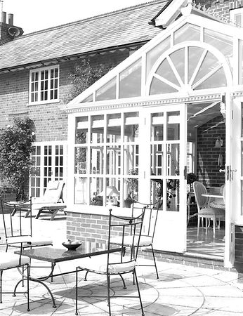 Exterior Of House With Conservatory And Patio