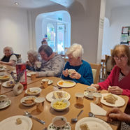 residents sat at a table at lunch time