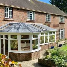 conservatory with SupaLite roof in large garden