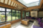 Glass and timber conservatory looking towards the garden