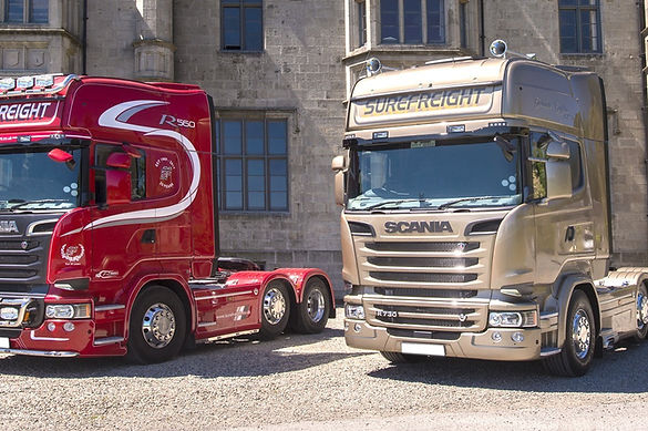 Surefreight cabs outside stately building