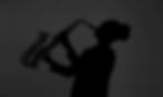 Silhouette of woman playing a saxophone