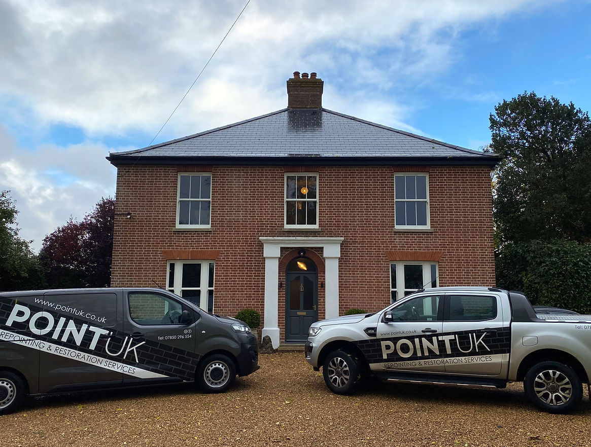 Newly restored detached home with POINT UK vans outside