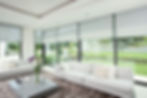 Smart electric blinds in high living seating area