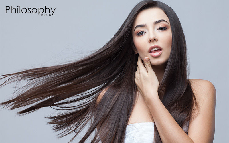 Woman with long, flowing, healthy dark hair.