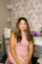 Alicia sitting in her cozy NW Calgary home studio, ready to create personalized beauty and tattoo work.