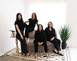 •	Team of consultants from Your Wedding Place sitting together on a couch