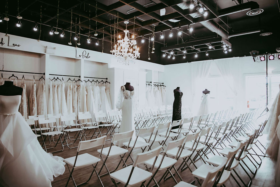 Runway fashion show inside Your Wedding place set up with chairs and gowns