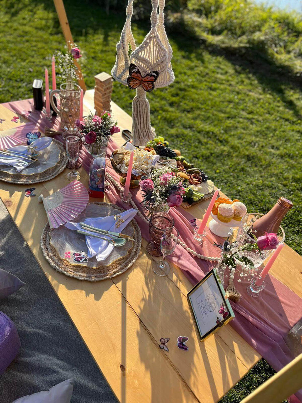 Kids picnic setup in the Butterfly Garden theme with pink elegance by Sunkissed Design & Co.