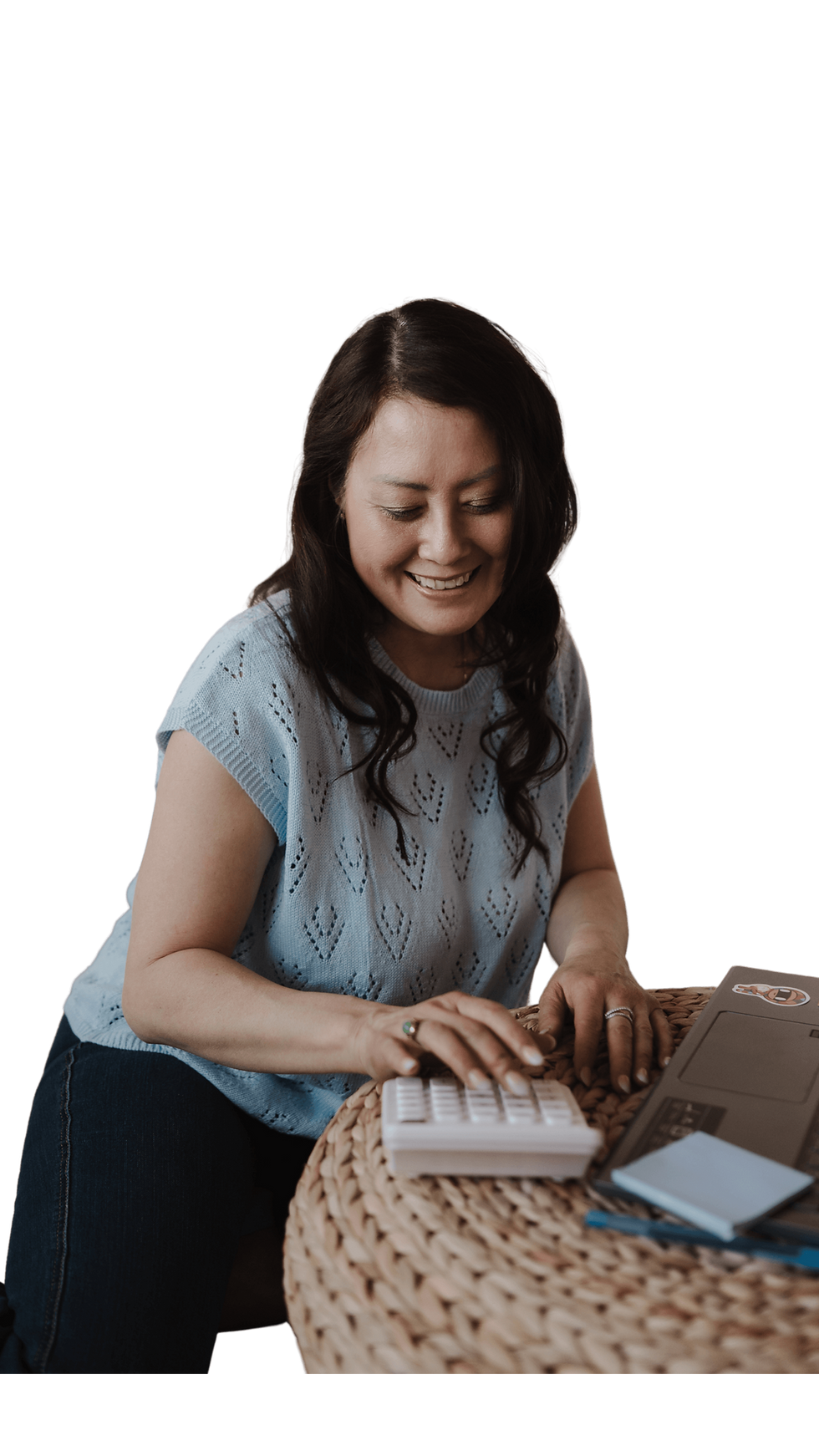 Natalya doing some insurance planning using a calculator and her computer