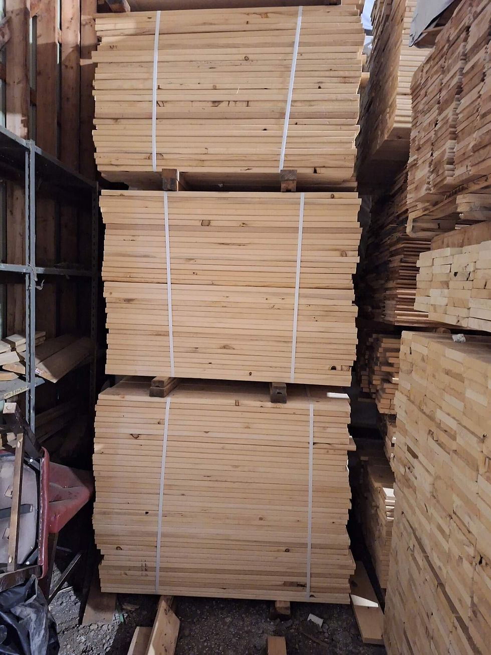 Stacks of yellow cedar boards in warehouse