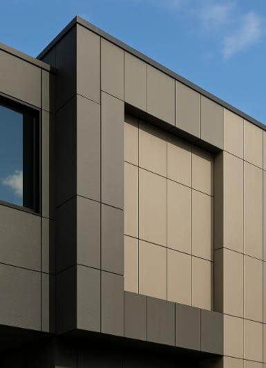 Building façade detailed with durable fiber cement and phenolic laminate panels.