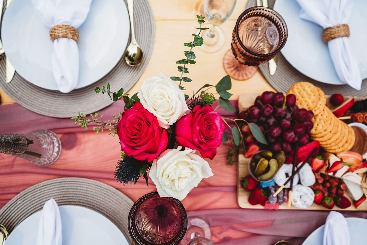 Close-up of the Pretty in Pink picnic setup with pink and white decor by Sunkissed Design & Co.
