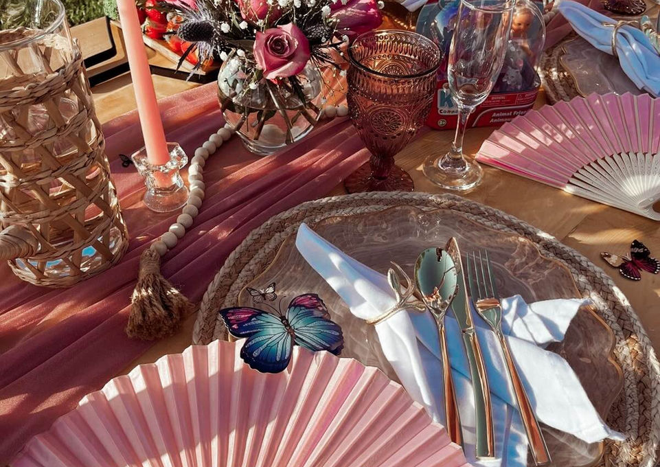 Close-up of the Butterfly Garden kids picnic setup with pink decor by Sunkissed Design & Co.

