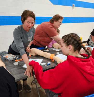 Amber helping a student for a nursing job fair in her local community Innisfail.