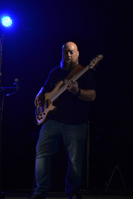 Brian Trammell performing live on five-string bass guitar