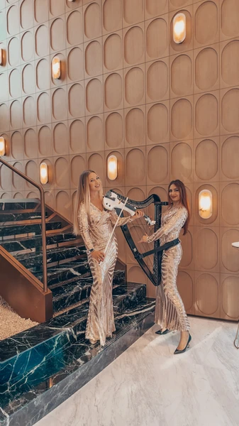 Acoustic and electric harp and violin duo performing elegant live music for weddings, luxury events, corporate events and private celebrations in Dubai