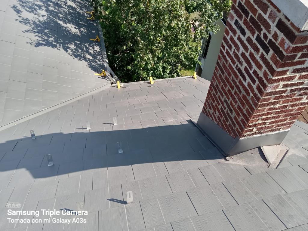 Metal roof installation by Milan's Roofing