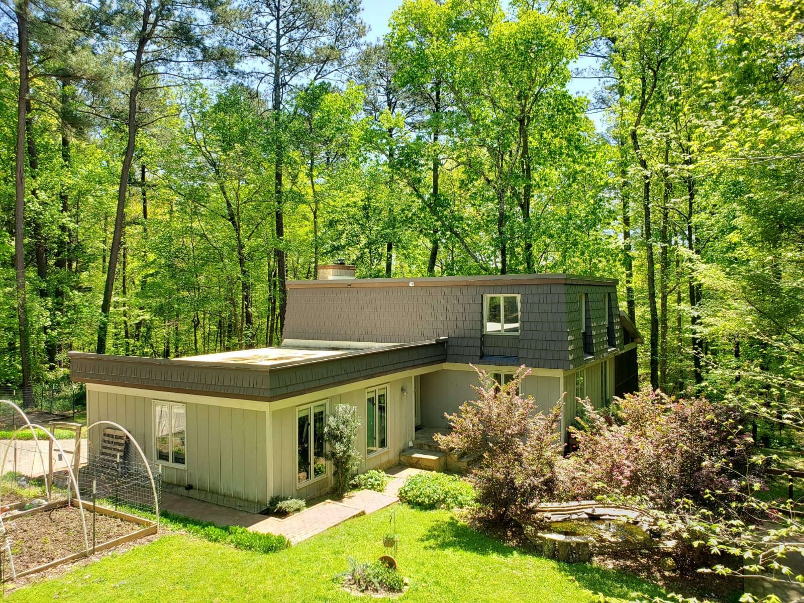 Rustic metal shingle completed roof