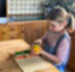Claudine's kids how that even kids can cook delicious healthy meals from scratch. Here her daughter peels lemon zest for the super healthy and easy to make salmon en croute recipe
