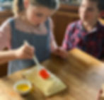 Healthy food with healthy ingredients: here Claudine's daughter decorates the salmon en croute with egg yolk to make it glisten when it has cooked