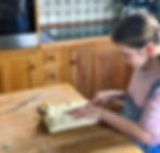 Claudine's children showing how to make the salmon en croute, here folding over the puff pastry to make a super delicious, healthy and easy and quick to make salmon en croute that's a perfect dinner recipe
