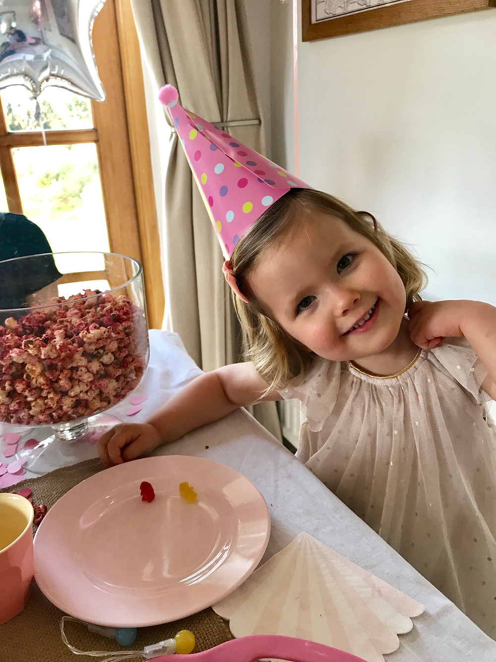 Make popcorn pretty and pink using healthy freeze-dried raspberry powder; an easy trick to make popcorn super appealing