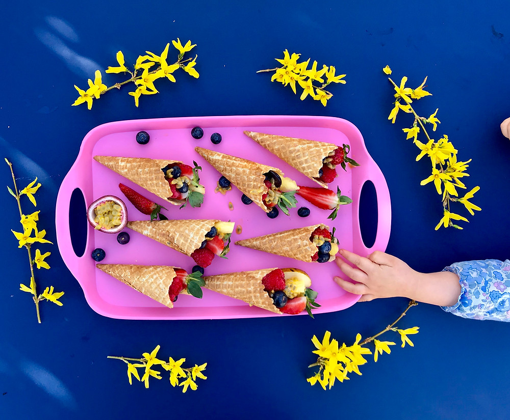 Healthy icecreams; these waffle cones are filled with fresh fruit to make a tasty and nutritious snack
