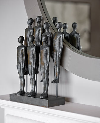 Decorative sculpture displayed on mantelpiece adding artistic detail within a luxury living room setting