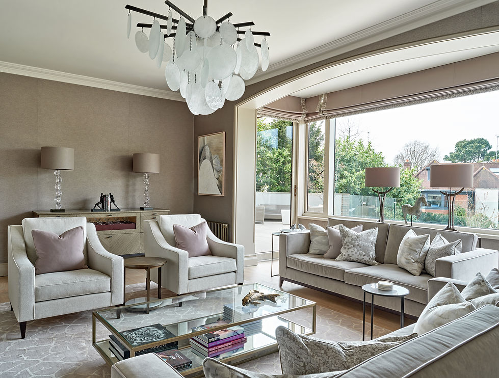 Luxury living room with large windows, statement lighting and soft furnishings enhancing light and comfort