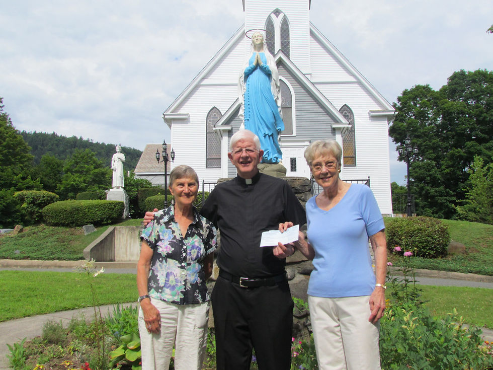 Father Tony presents Change for Babies donation to Susan Maddern [L] and Marie Beeching [R] of Alternative's Pregnancy Center