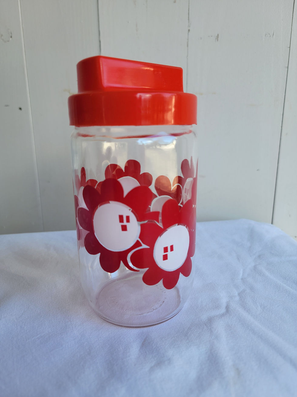 Bocal vintage avec couvercle marque Henkel décor motif fleurs rouges