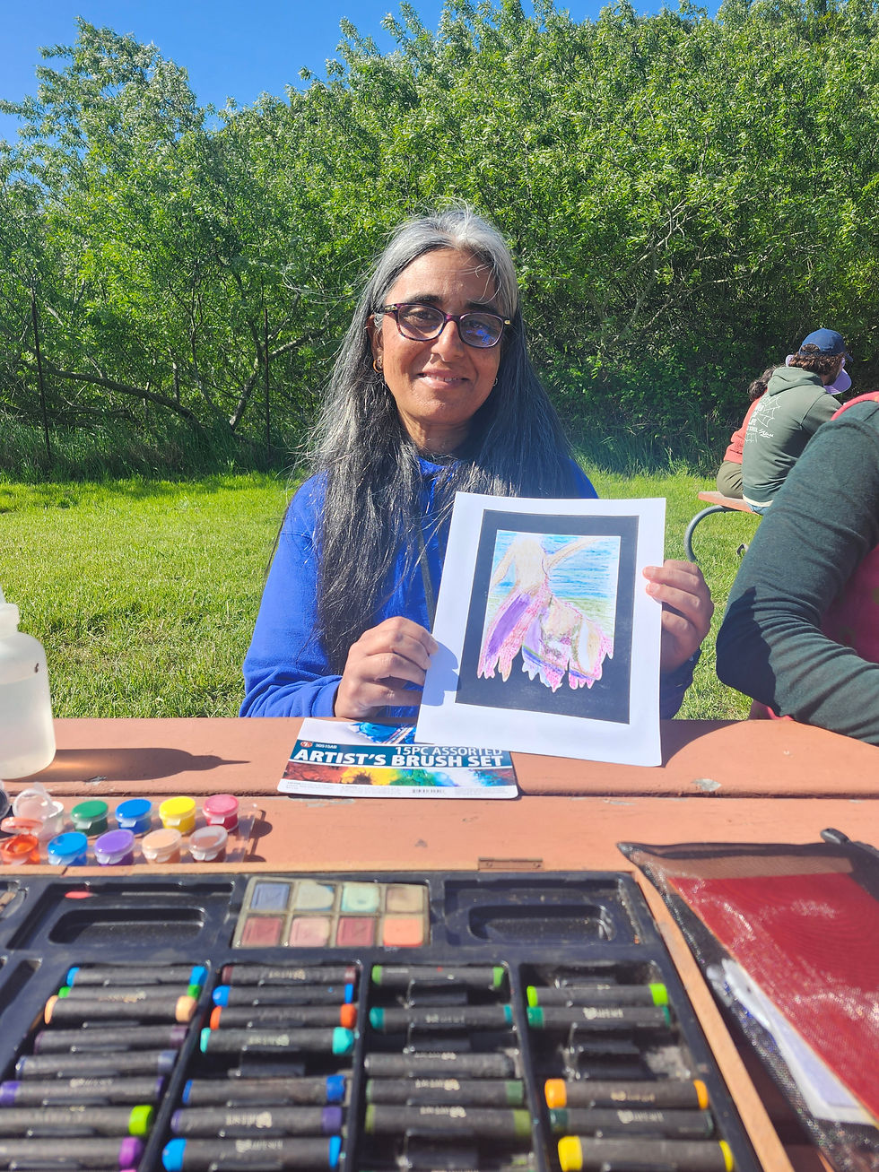 An Environmental Educator shows her Story Stone Painting
