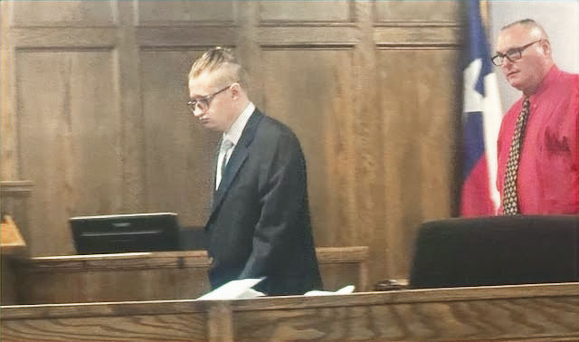 Defendant Charles Broyles is escorted into the courtroom Tuesday by Erath County bailiff Robbie Rudder. Sara Vanden Berge/photos