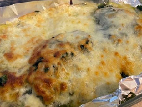 Basil pesto chicken with spinach and tomatoes reminds me of an afternoon in Cinque Terra.