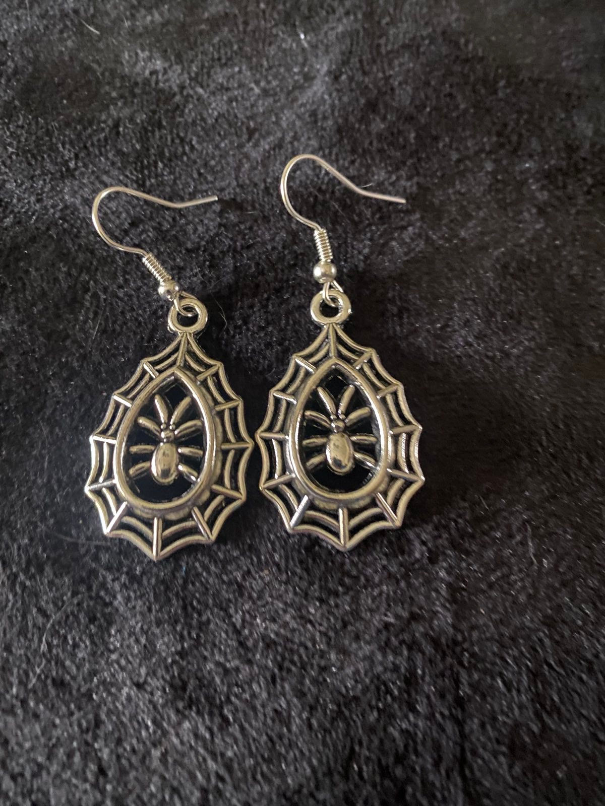 Teardrop shaped spider web jewellery