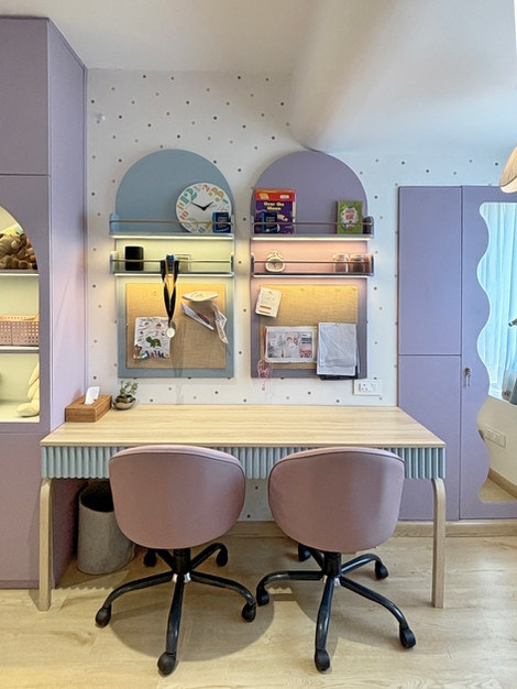Cozy workspace with pastel colors and modern decor.