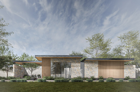 Modern farmhouse with stone and wood exterior, cloudy sky.