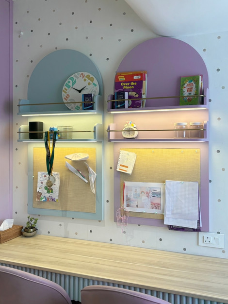 Colorful wall shelves with books and decorative items.