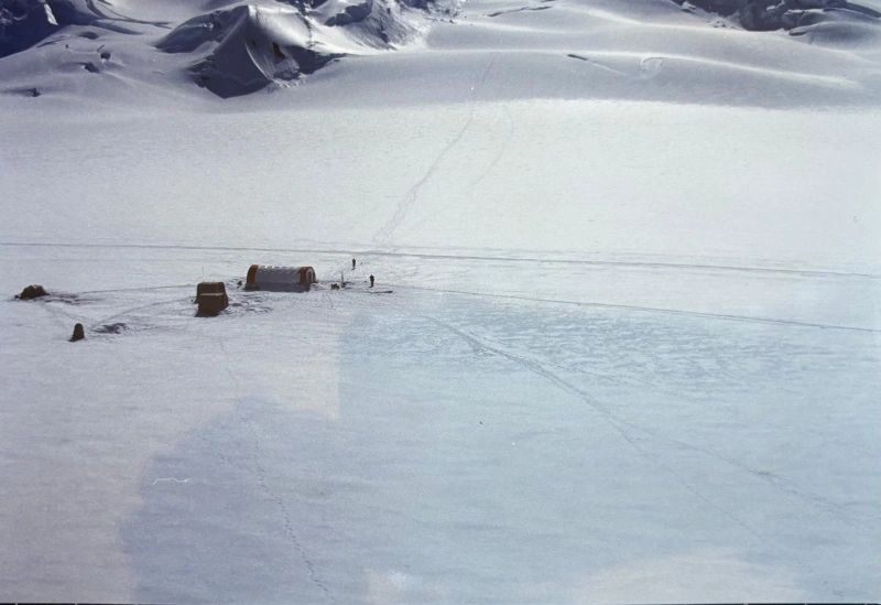 Dramatic scene showing vast snowscape with Quonset Hut at Mt. Logan Airstrip.
