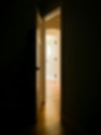 An open doorway with soft natural light beyond, used to symbolise the gentle progression of growing the comfort zone one small step at a time.