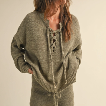 Sage lace-up knit sweater with braided ties and relaxed fit, cozy fall style available at Reed Homestead.