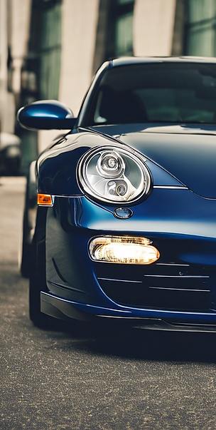 closeup of the front of a early 2000's Porche 997_edited.png
