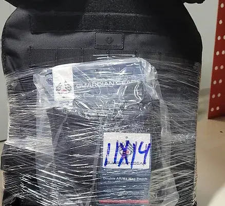Ammunition package wrapped in plastic with 11x19 tag