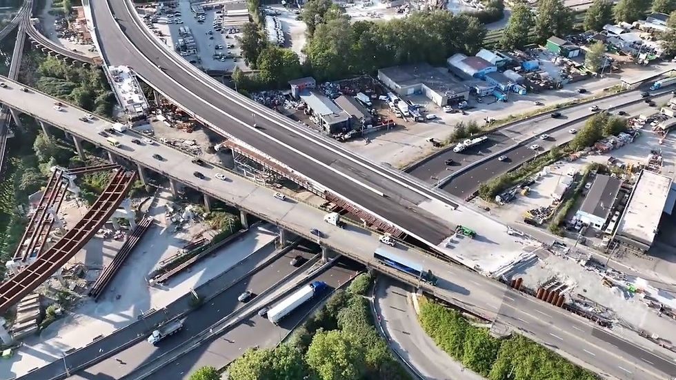 Construction for the stal̕əw̓asəm (Riverview) Bridge over traffic underneath.